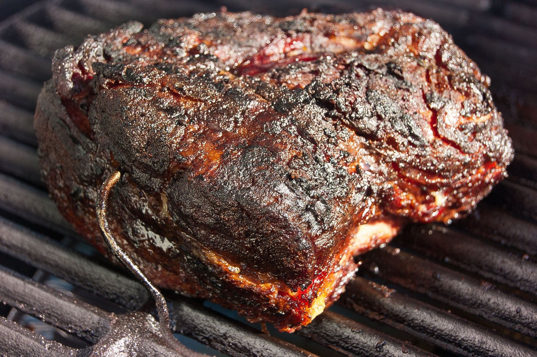 Meat roasting over an open grill